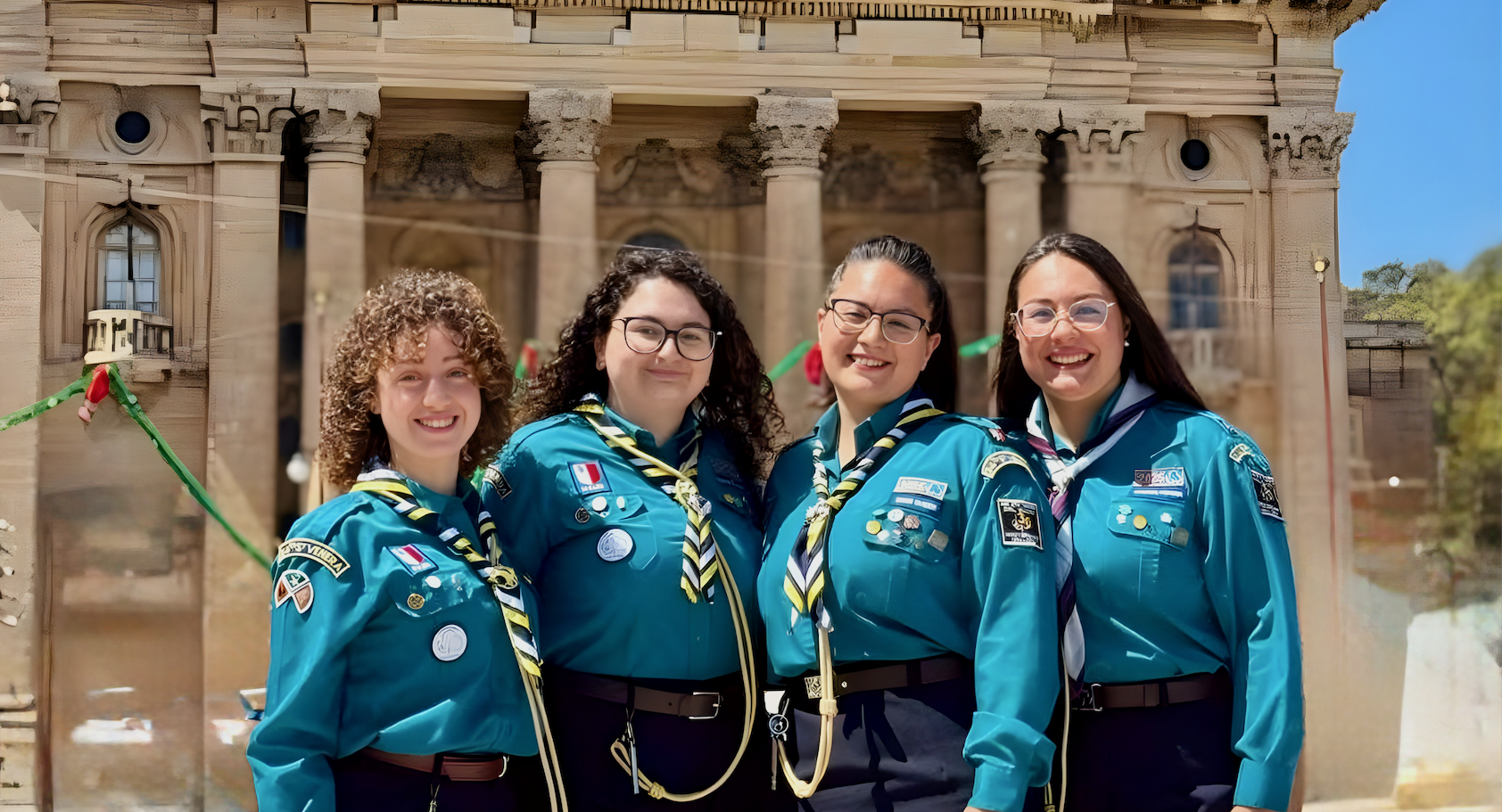 Leaders smiling together on a hill